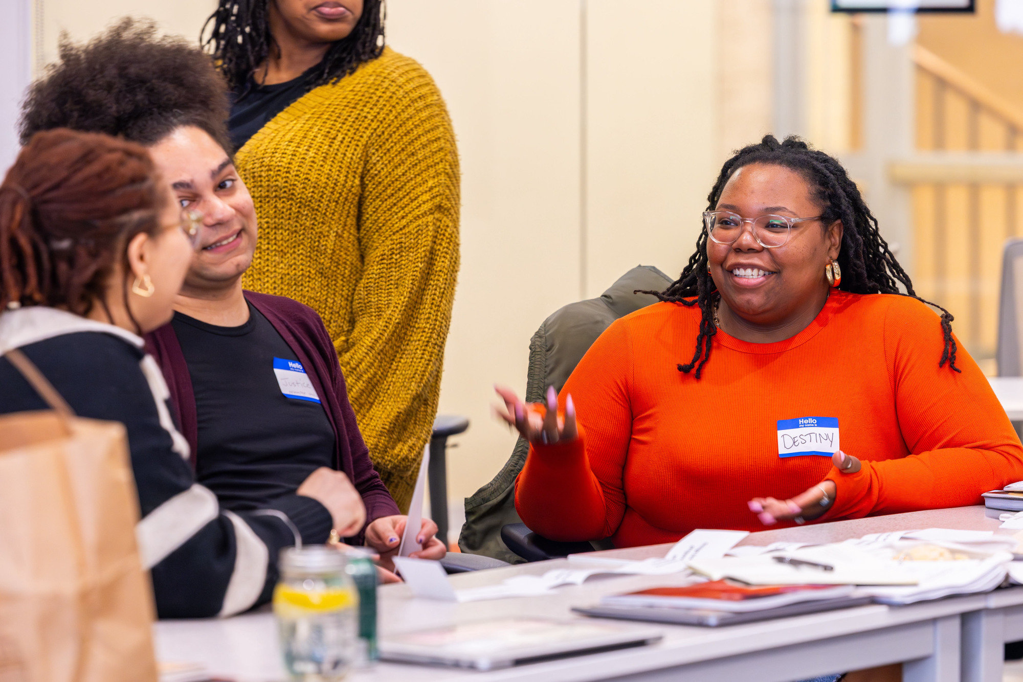 A group of educators conversing at a table.