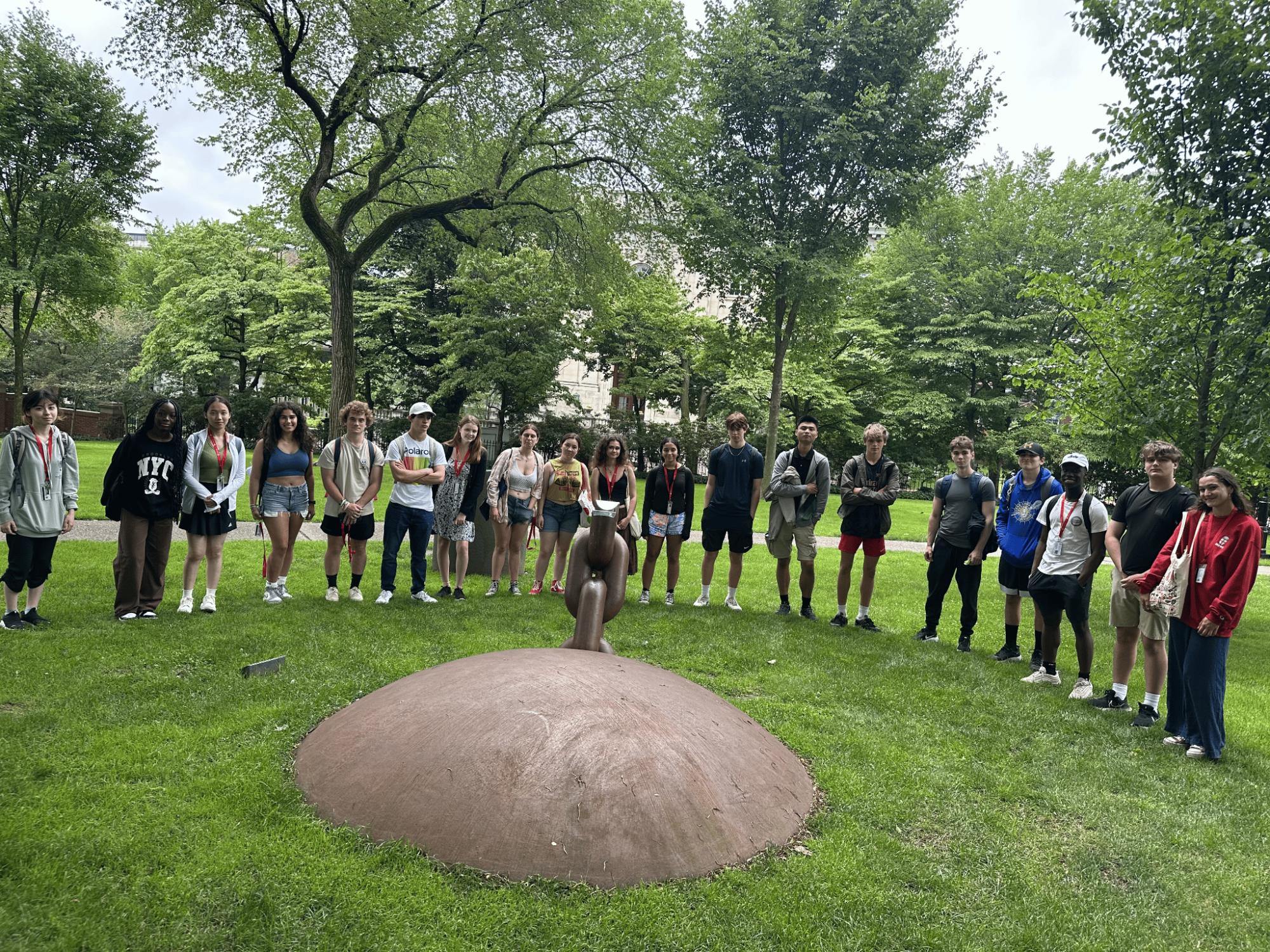 Group of students standing around a chain monument on Brown's Quiet Green