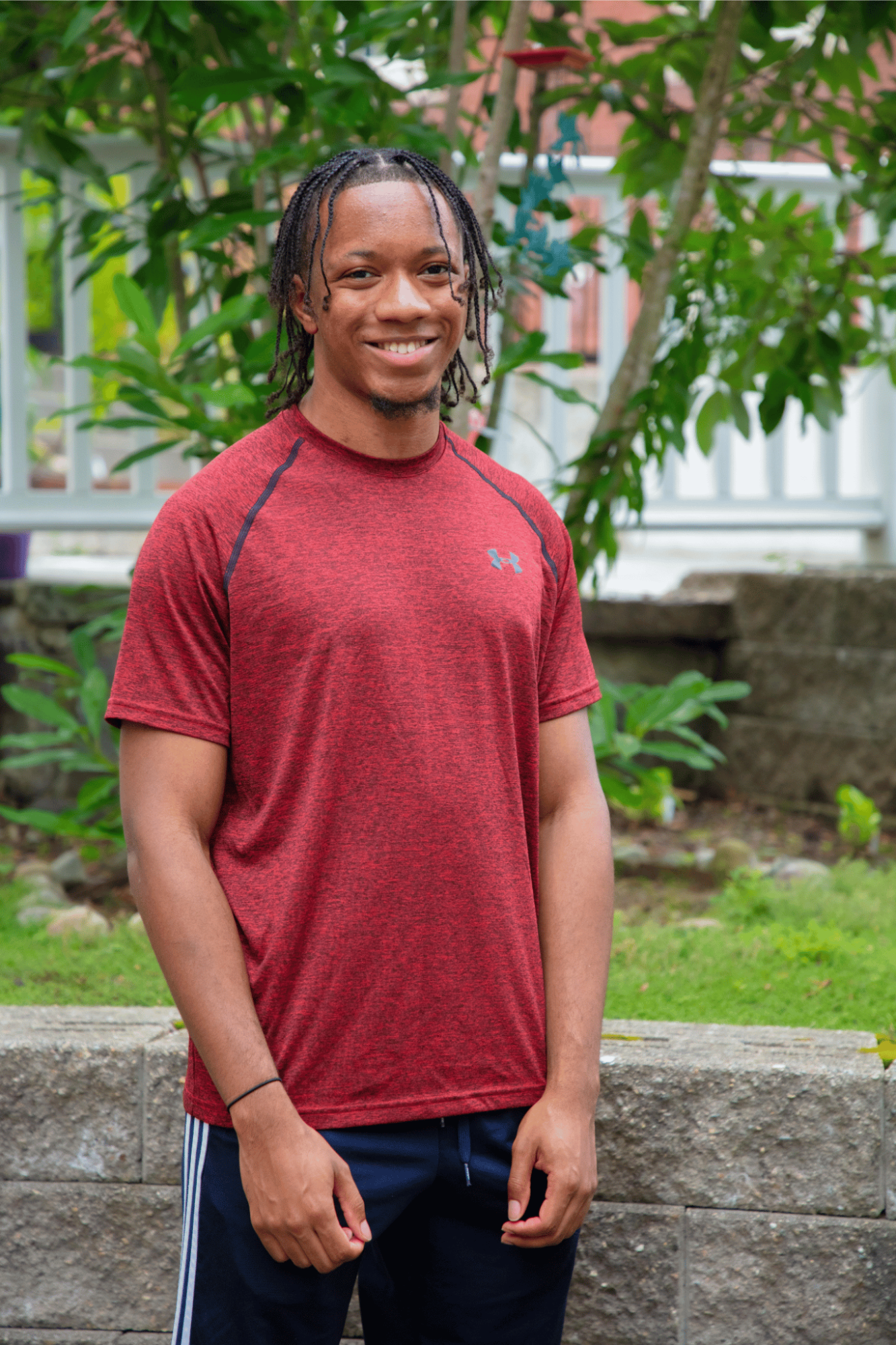 Man standing in front of trees