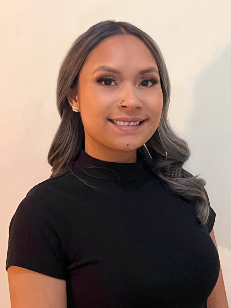 A woman smiling at the camera