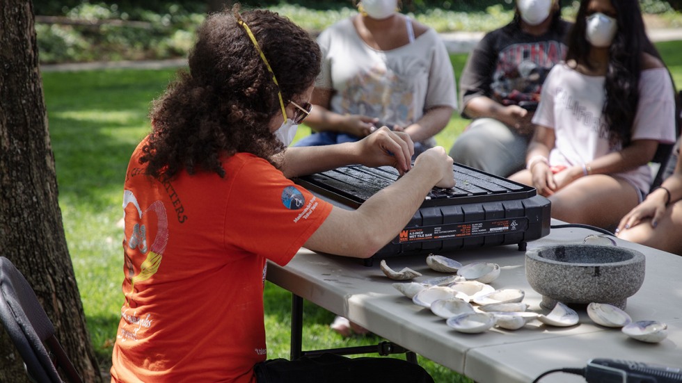 Stone Thomas demonstrated cutting wampum on the wet saw