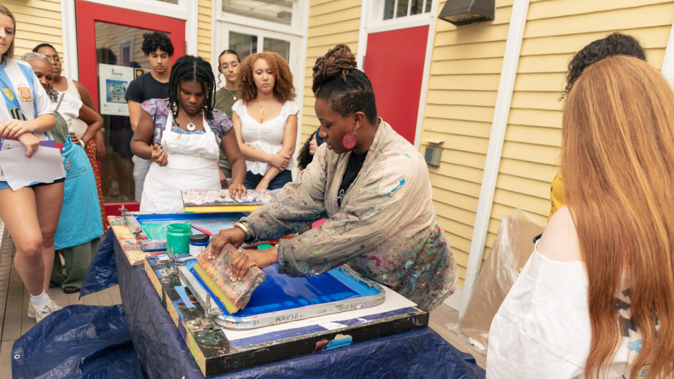Group of people making screen prints.