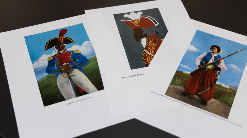 Three pieces of paper with reproductions of colorful paintings of historic military figures.